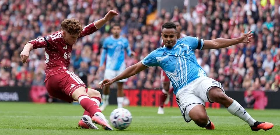 Player sliding for the ball during match action