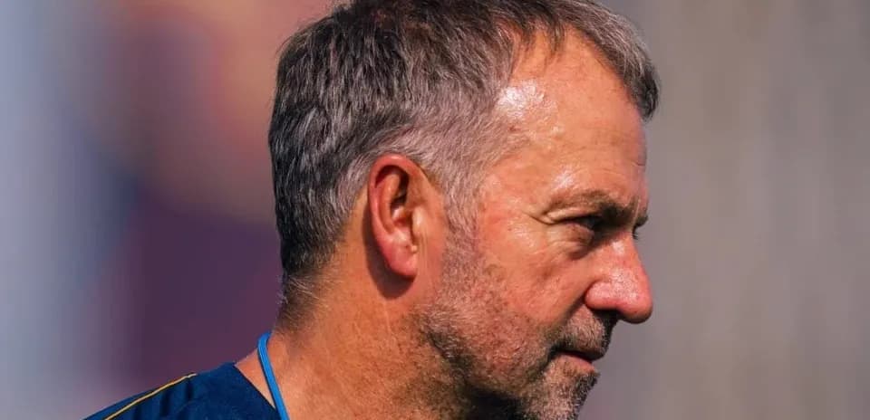 Coach observing players during training session