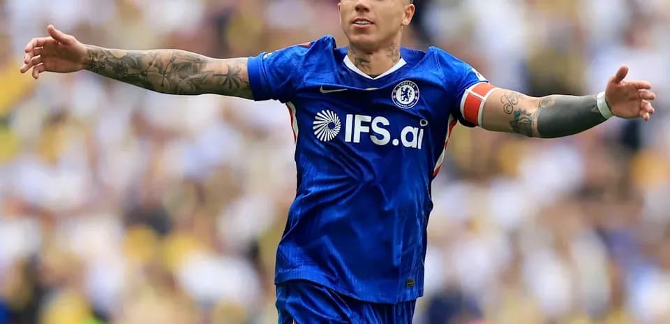 Player celebrating in Chelsea blue jersey on field