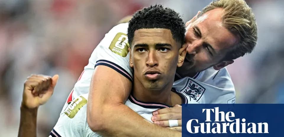 Two England players celebrating a goal together
