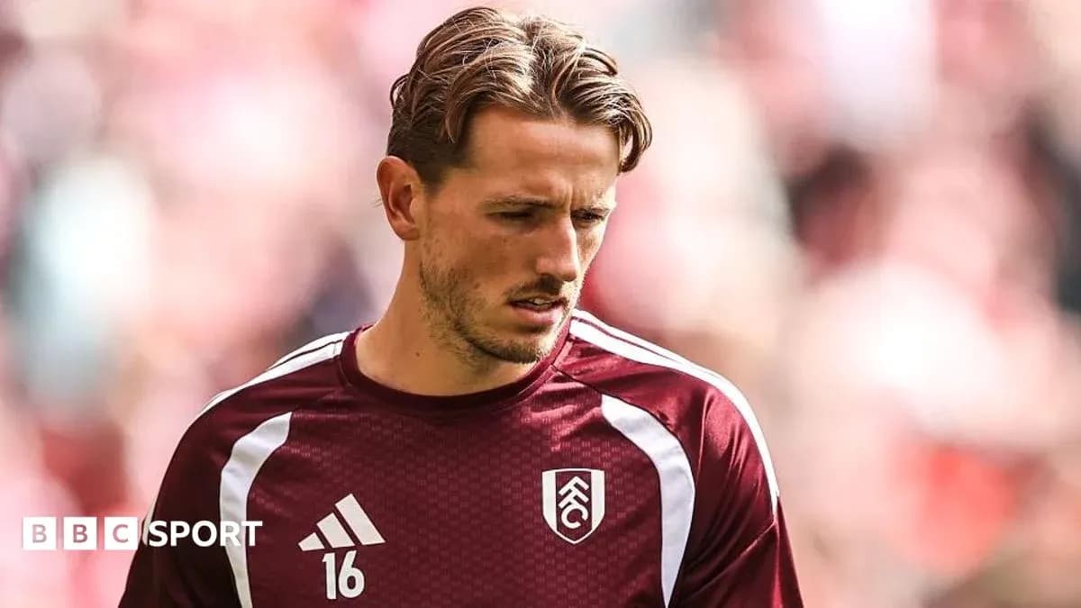 Player wearing maroon training kit before match