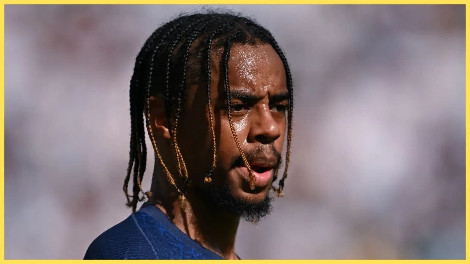 Player with braided hair during match action