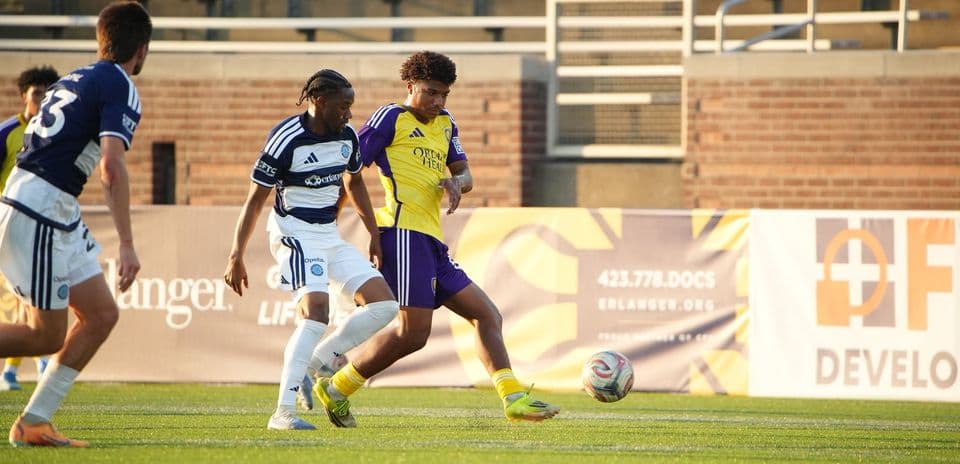 Orlando City II player tackling Chattanooga opponent