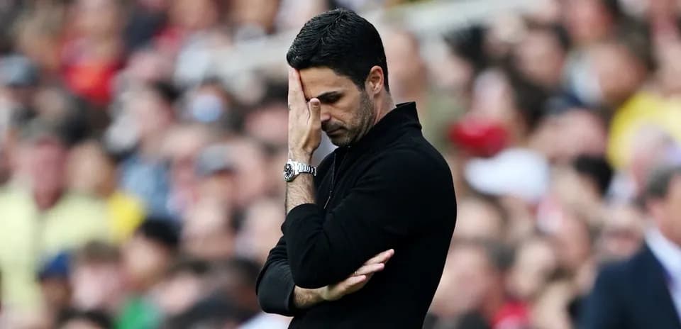 Manager looking concerned during match on sidelines