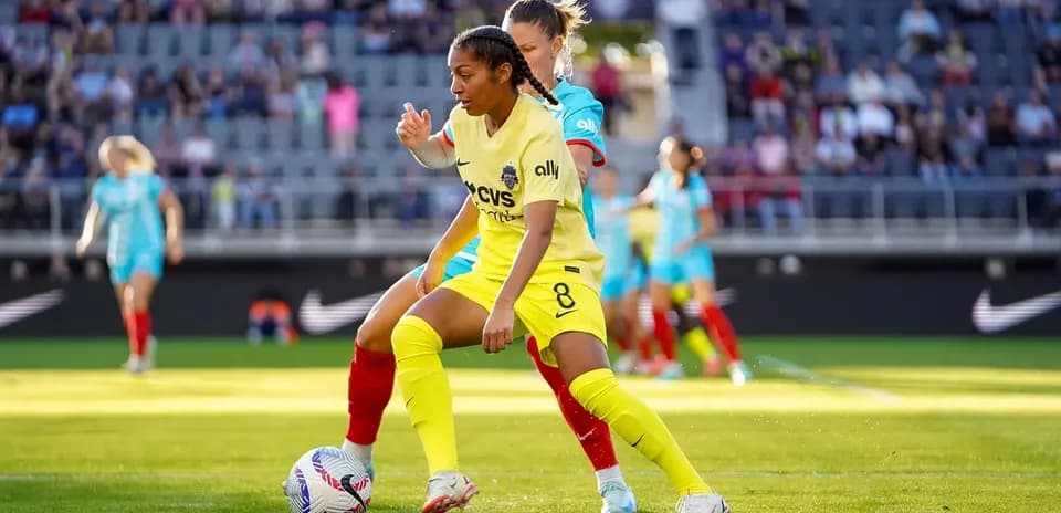 Players competing for the ball during match