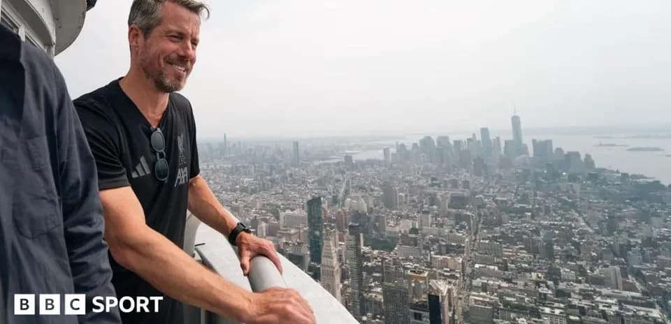 Person overlooking New York City skyline from high vantage point