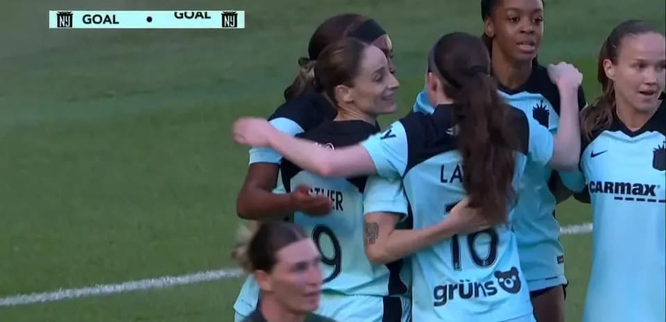 Players celebrating a goal during match