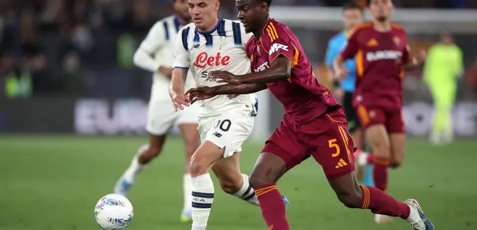AS Roma player challenging Atalanta for the ball