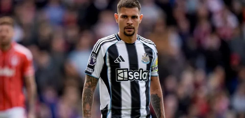 Newcastle player in black and white striped kit
