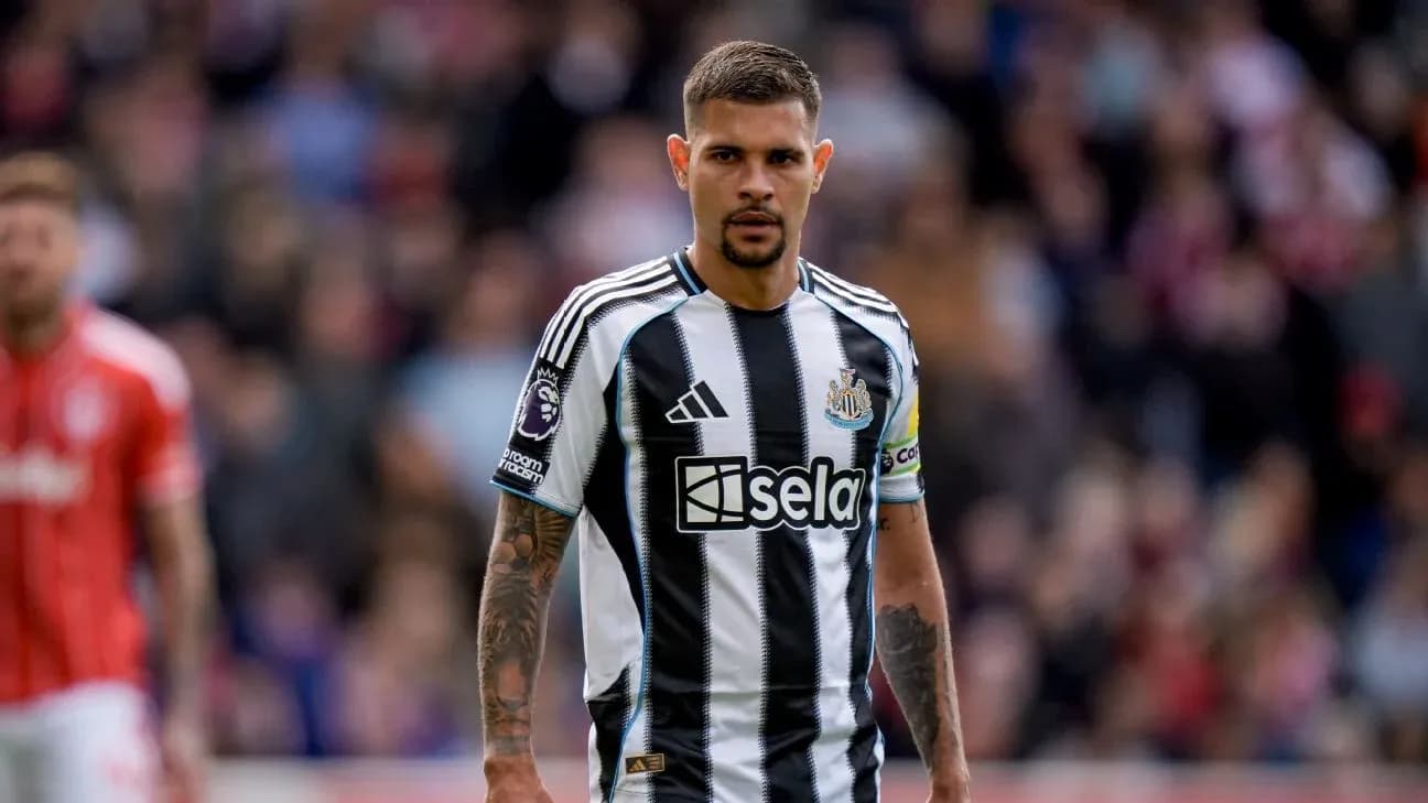 Newcastle player in black and white striped kit
