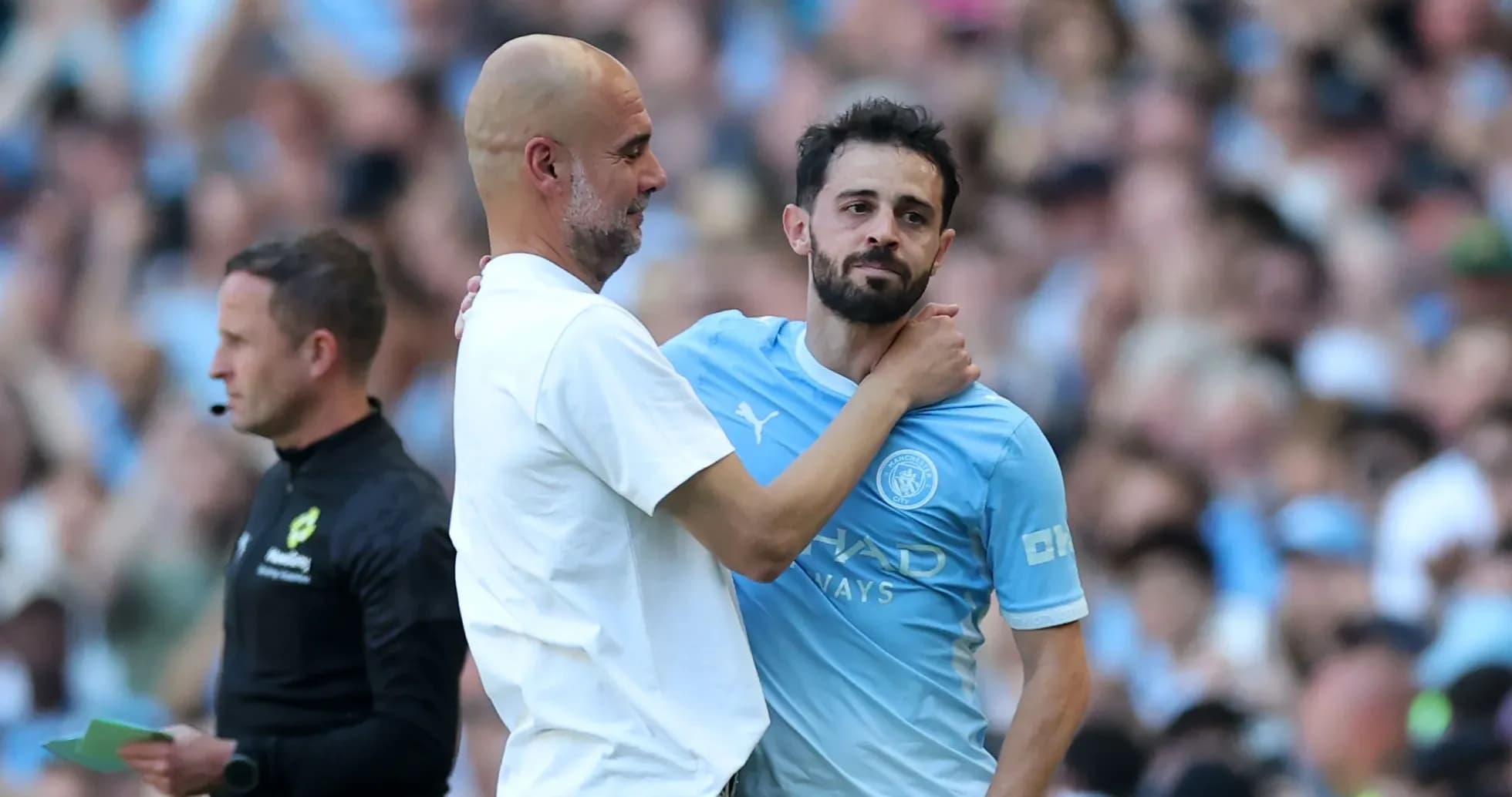 Pep Guardiola embracing Bernardo Silva on field