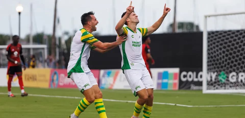 Tampa Bay Rowdies players celebrating a goal