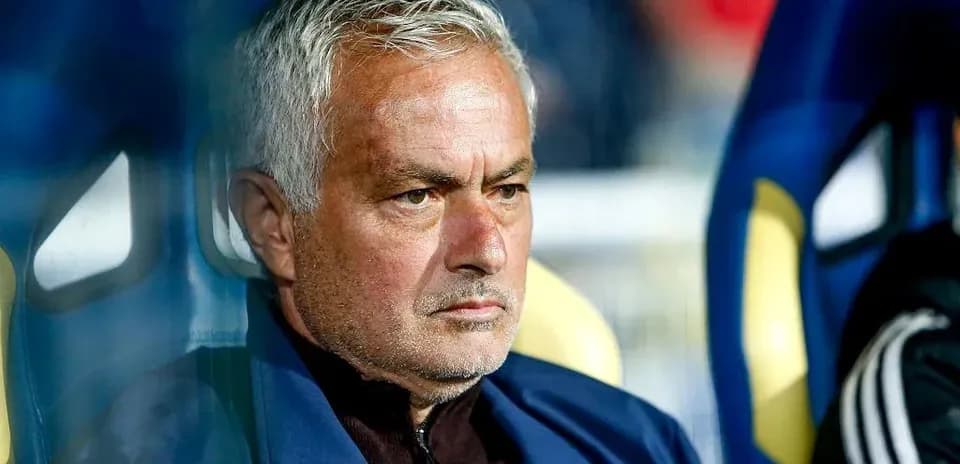 Coach sitting on the bench during a match