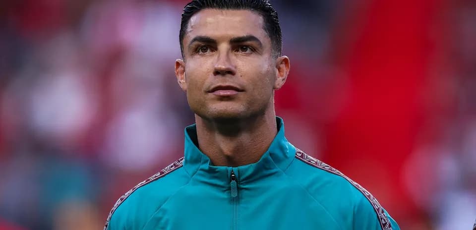Cristiano Ronaldo wearing training jacket on field