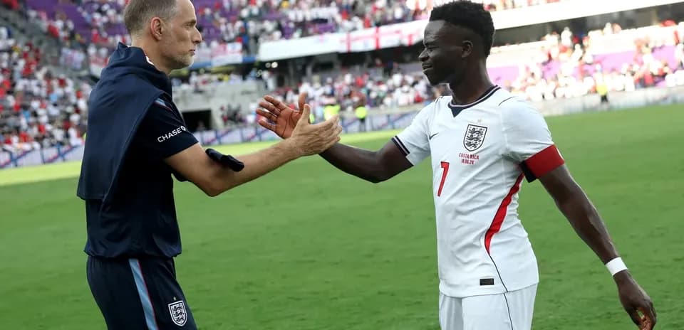 Coach and player celebrating after the match