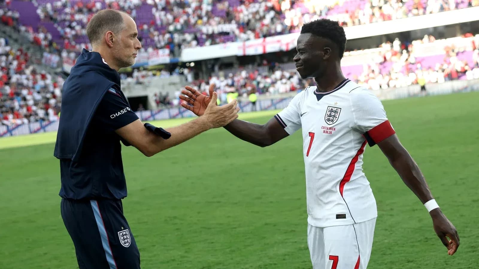 Coach and player celebrating after the match