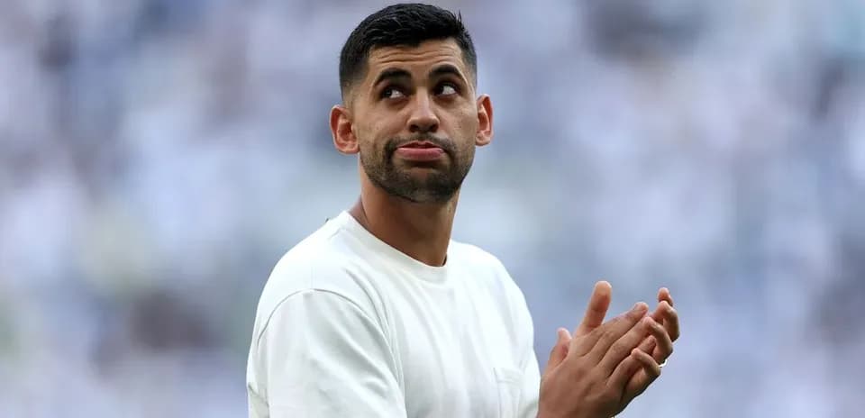 Player clapping and looking around during match