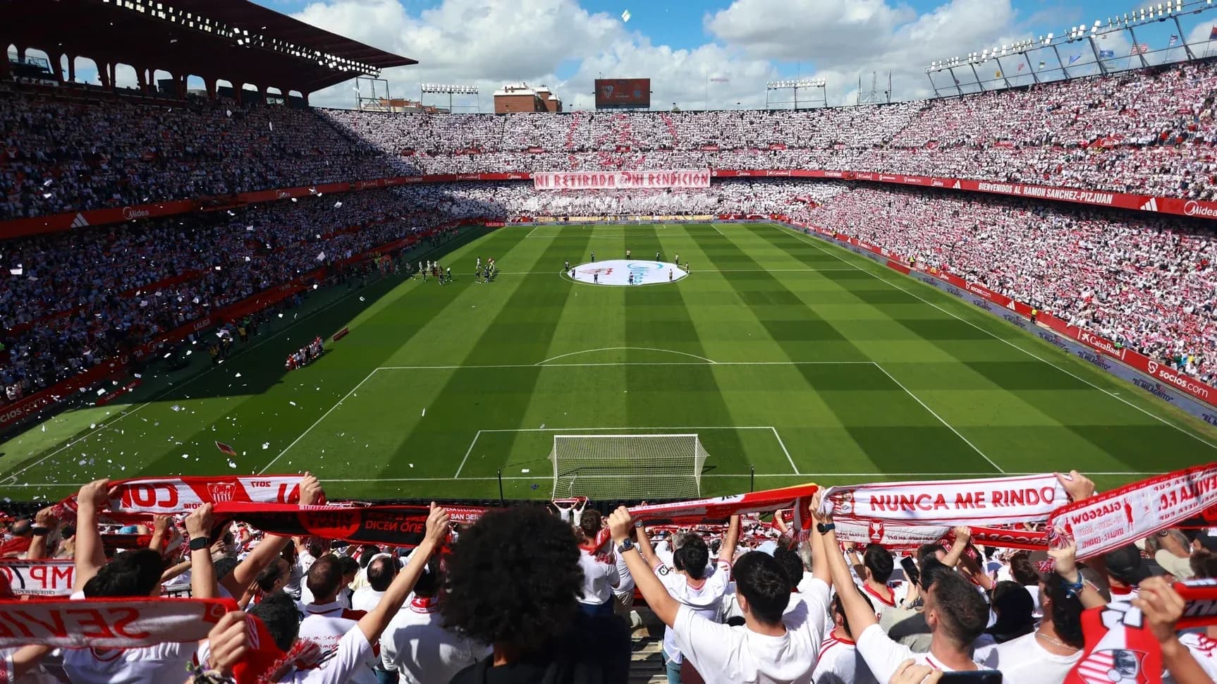 Fans cheering in stadium during Sevilla match