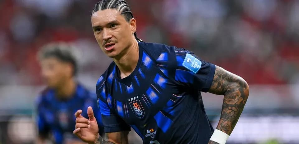 Player in blue jersey running during football match