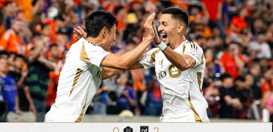 Players celebrating after scoring in match
