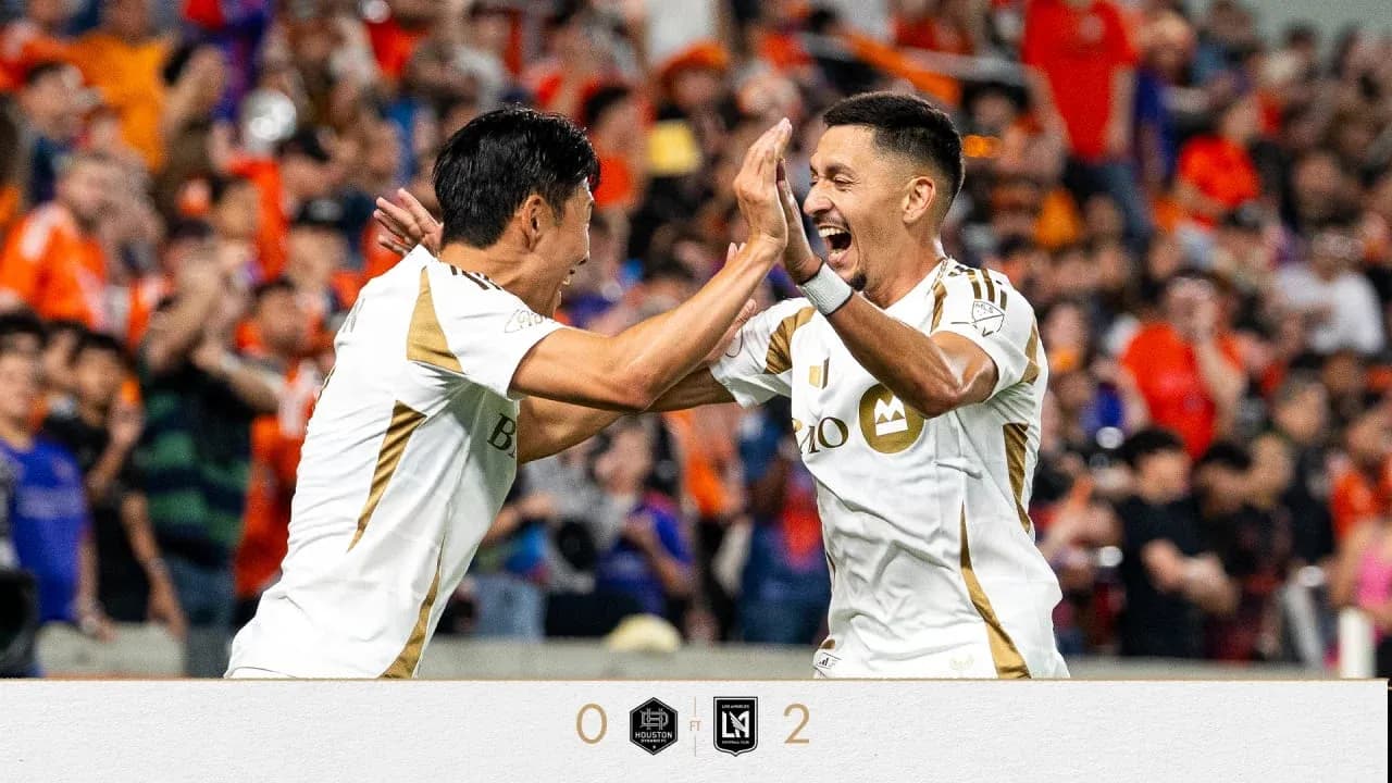 Players celebrating after scoring in match