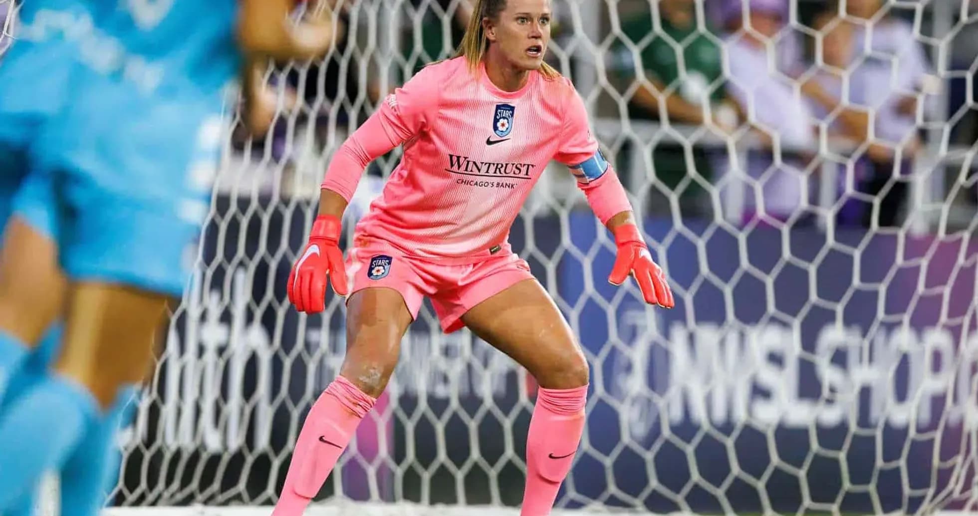 Goalkeeper preparing for action during match