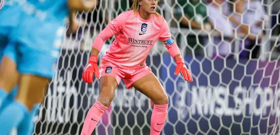 Goalkeeper preparing for action during match