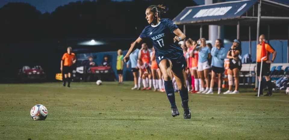 Player from Maine taking a corner kick during match