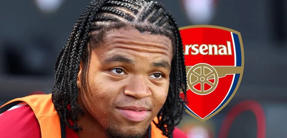 Player with braided hair in Arsenal jersey