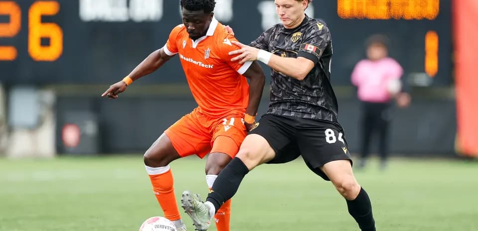 Players competing for the ball during match