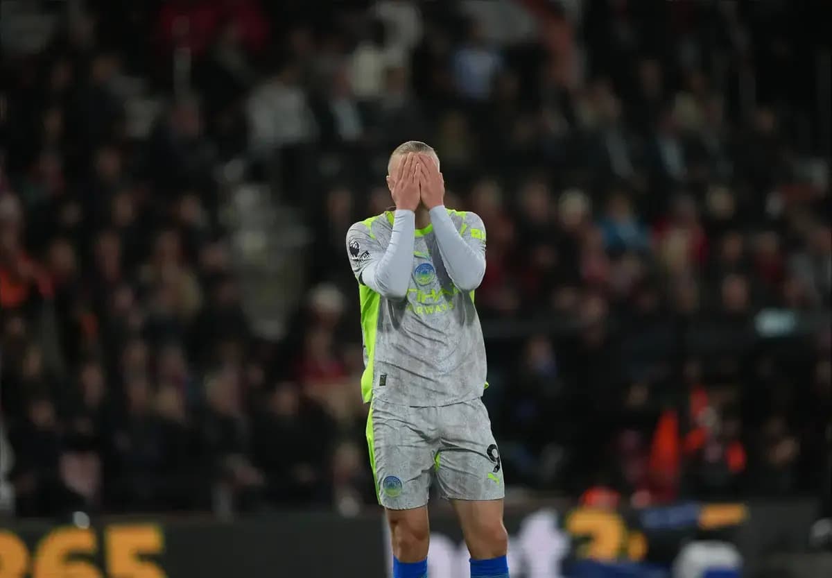 Goalkeeper with hands on face during match