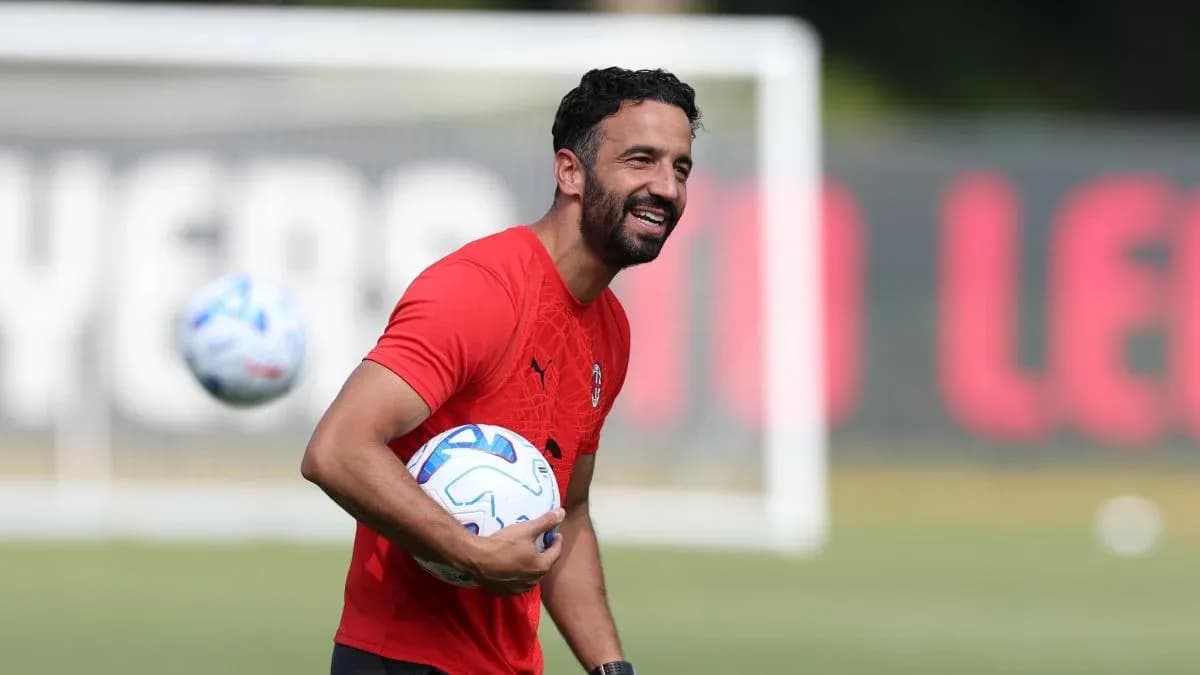 Coach holding a soccer ball during training session
