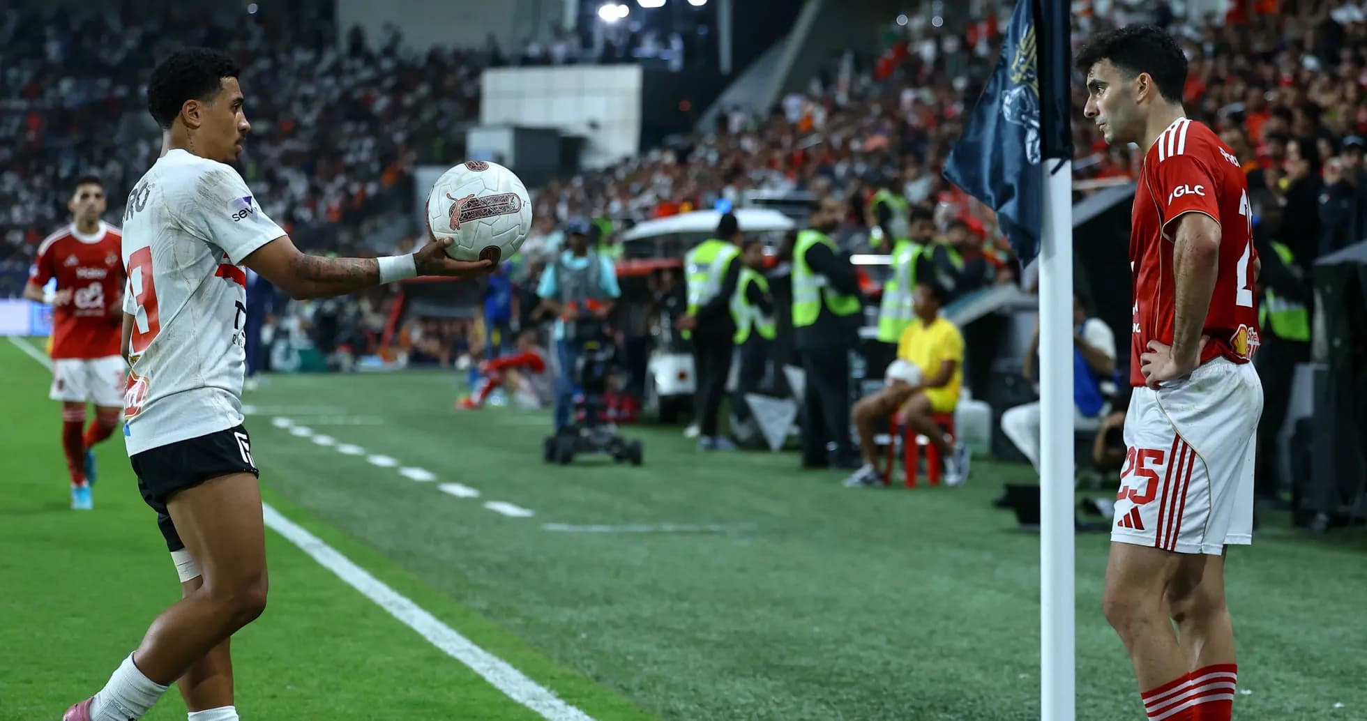 Player preparing to throw ball in football match