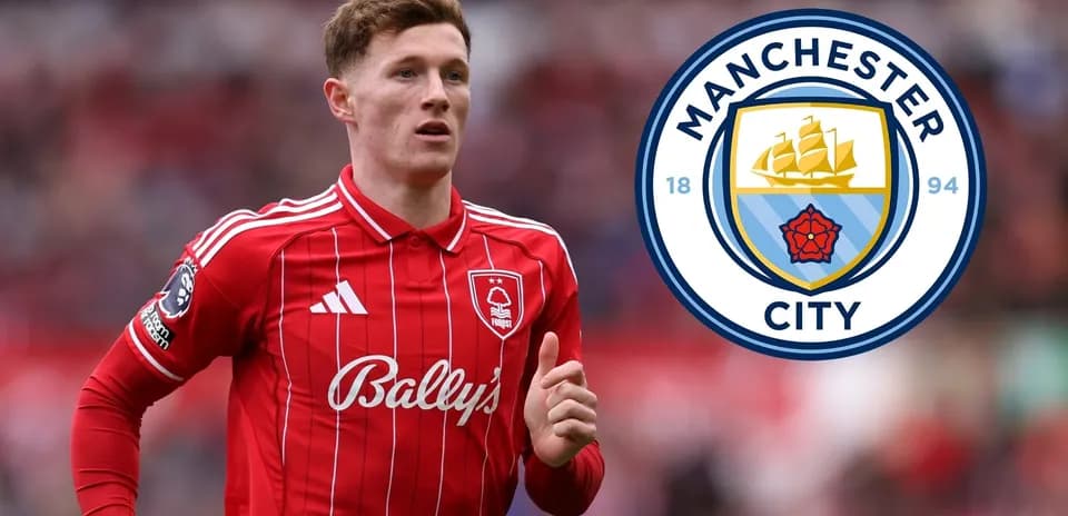 Player in red kit with Manchester City logo