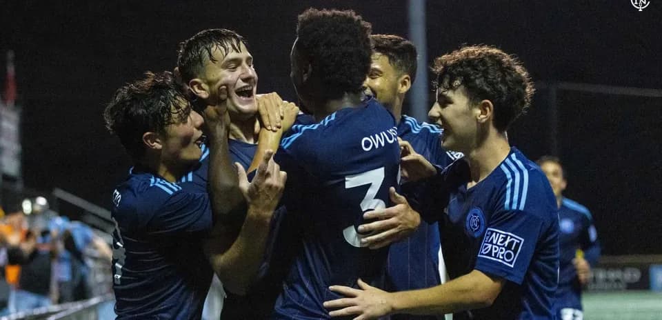 Players celebrating a goal during the match