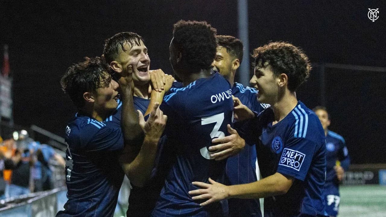 Players celebrating a goal during the match
