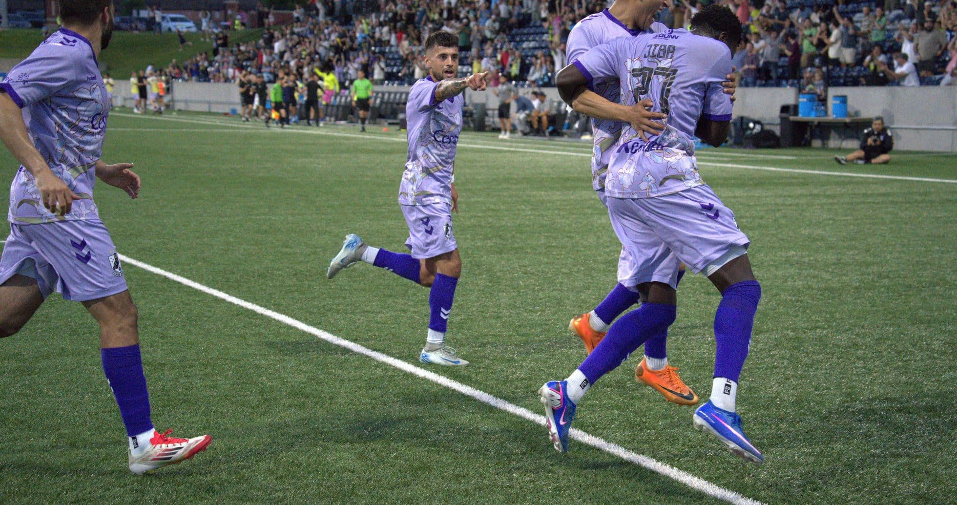Players celebrating a goal during match