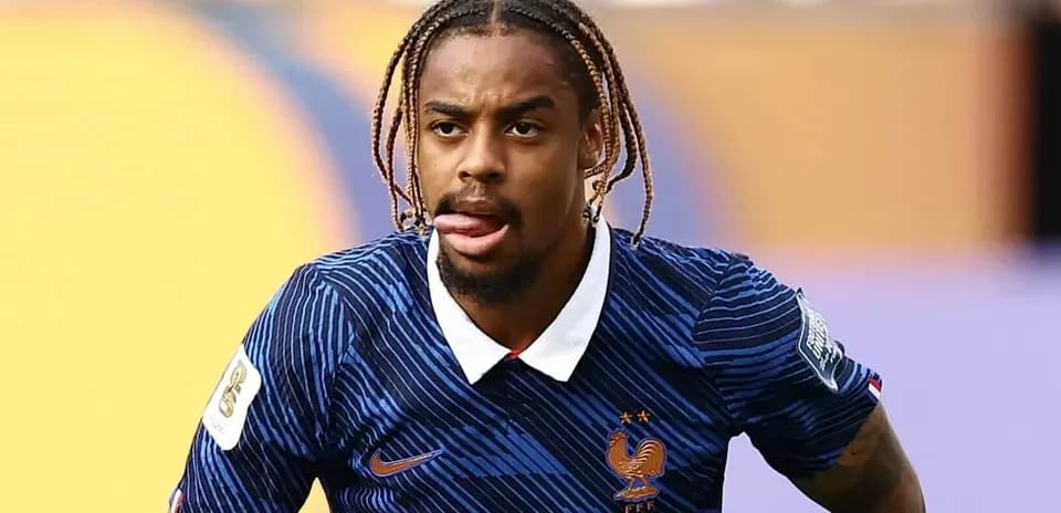 Player in France jersey running on the field
