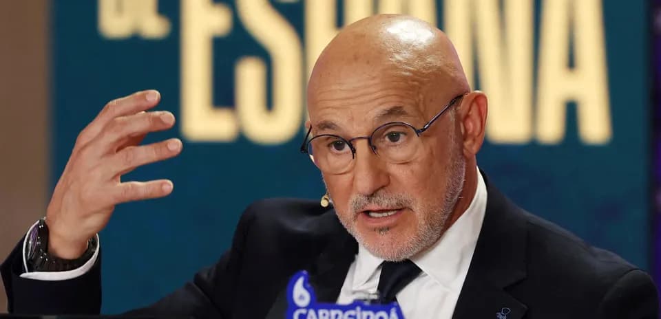 Man speaking at a press conference with logos