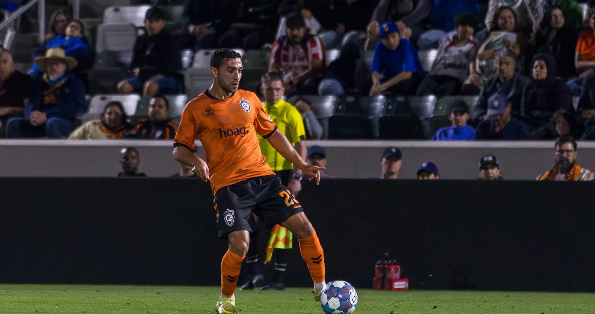 Player from Orange County SC with ball