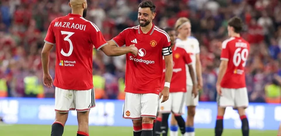 Bruno Fernandes and Mazraoui celebrating on the field
