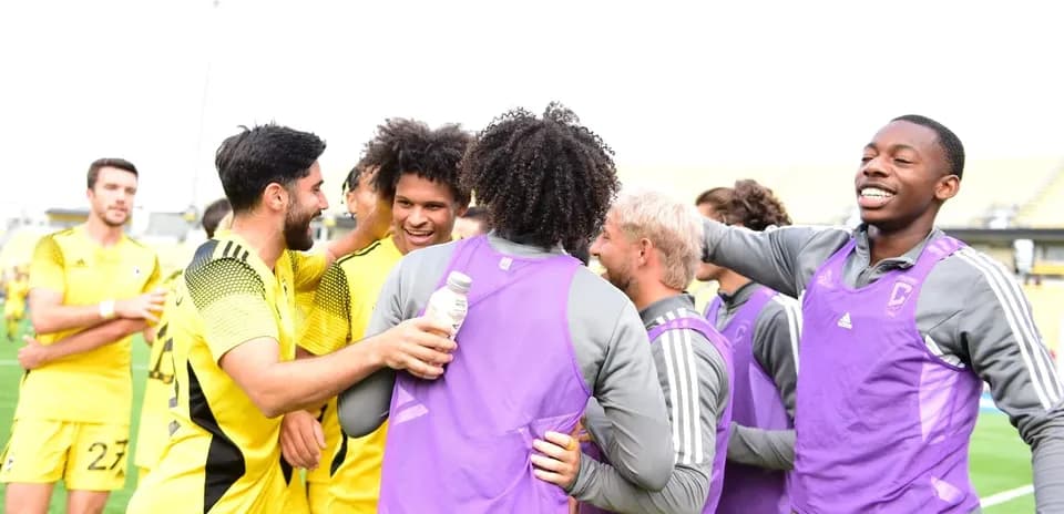 Players celebrating after a match victory