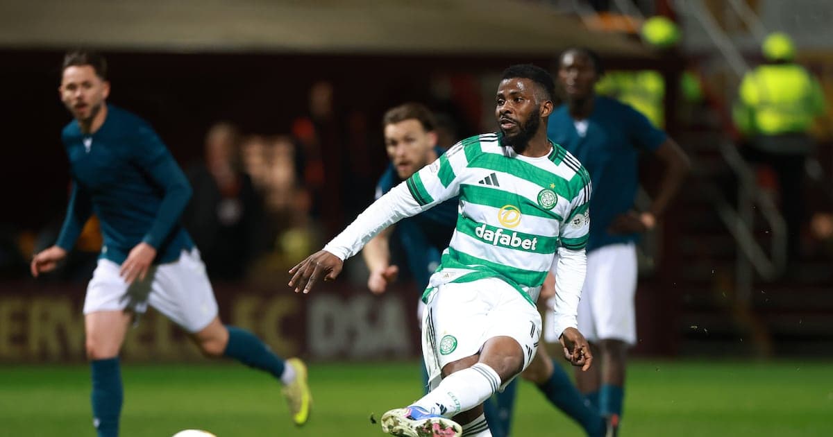 Celtic player dribbling ball during match action