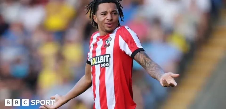 Player in Southampton kit gesturing during match