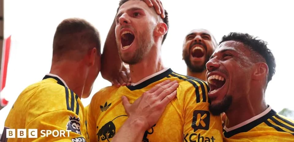 Players celebrating a goal with excitement