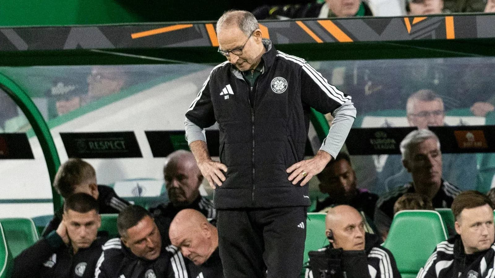 Manager looking down on the bench during match
