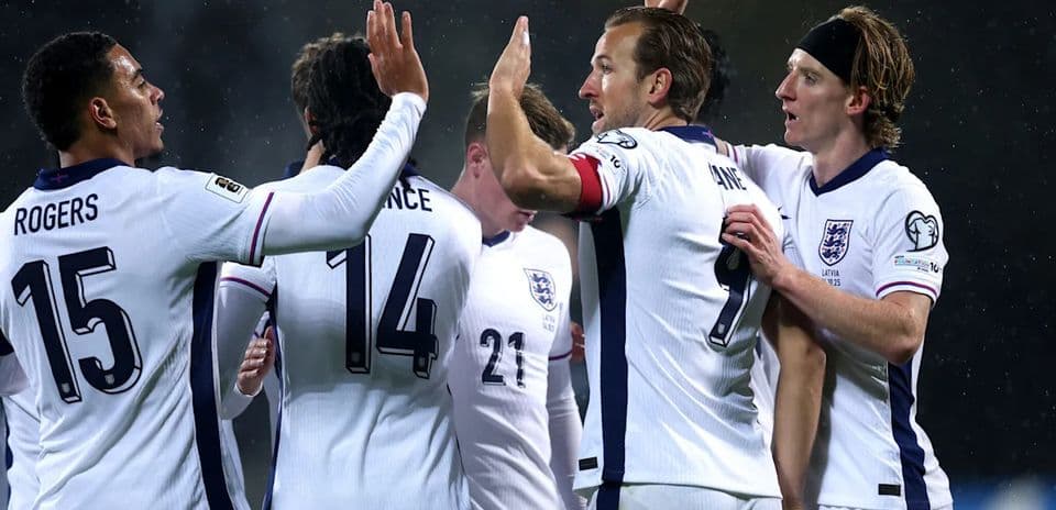 England players celebrating a goal during a match