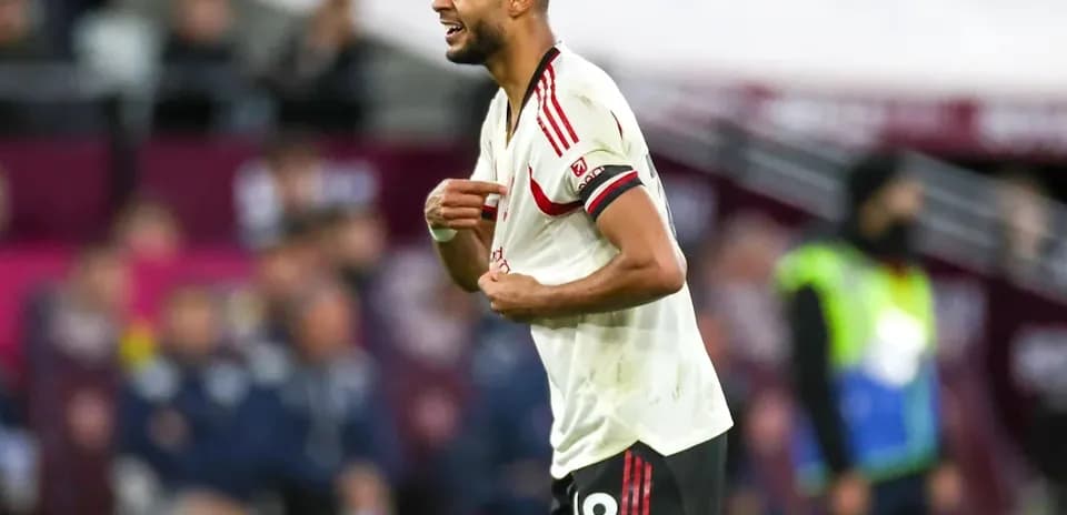 Player in white jersey reacting during match