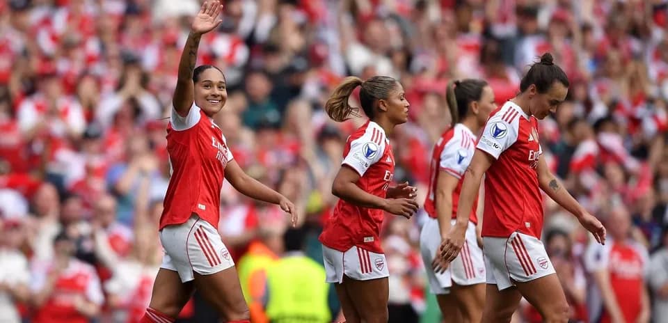 Arsenal players celebrating a goal during match