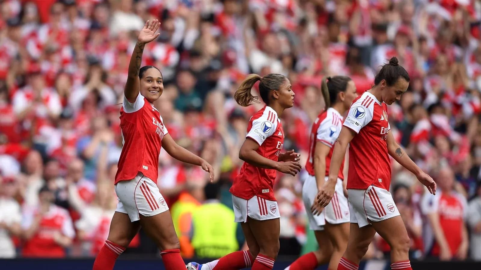 Arsenal players celebrating a goal during match